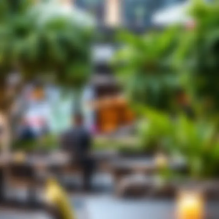 A vibrant outdoor dining area at Dubai Hills Mall, showcasing lush greenery and modern seating.